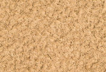 Yellowish granite wall with quarts and rough surface as background