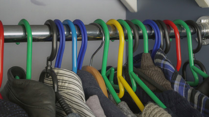 Clothes in the closet on hangers. Easy to work with files.