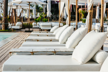 Luxury swimming pool and deck chair at the resort