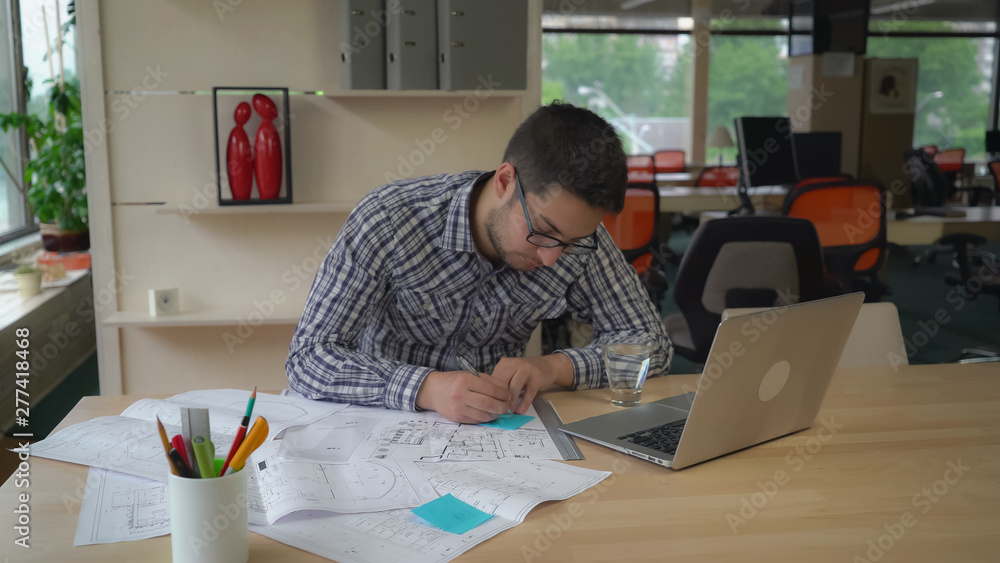 Poster professional engineer stick reminders on sketch blueprint.