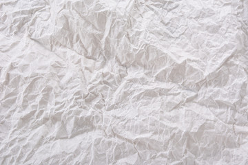 Textured clean sheet of crumpled paper white color empty background