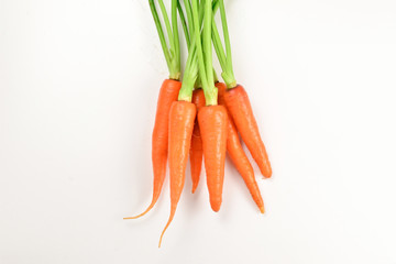 Fresh orange carrot on a white background.