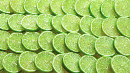 Fresh lime slices as a background.