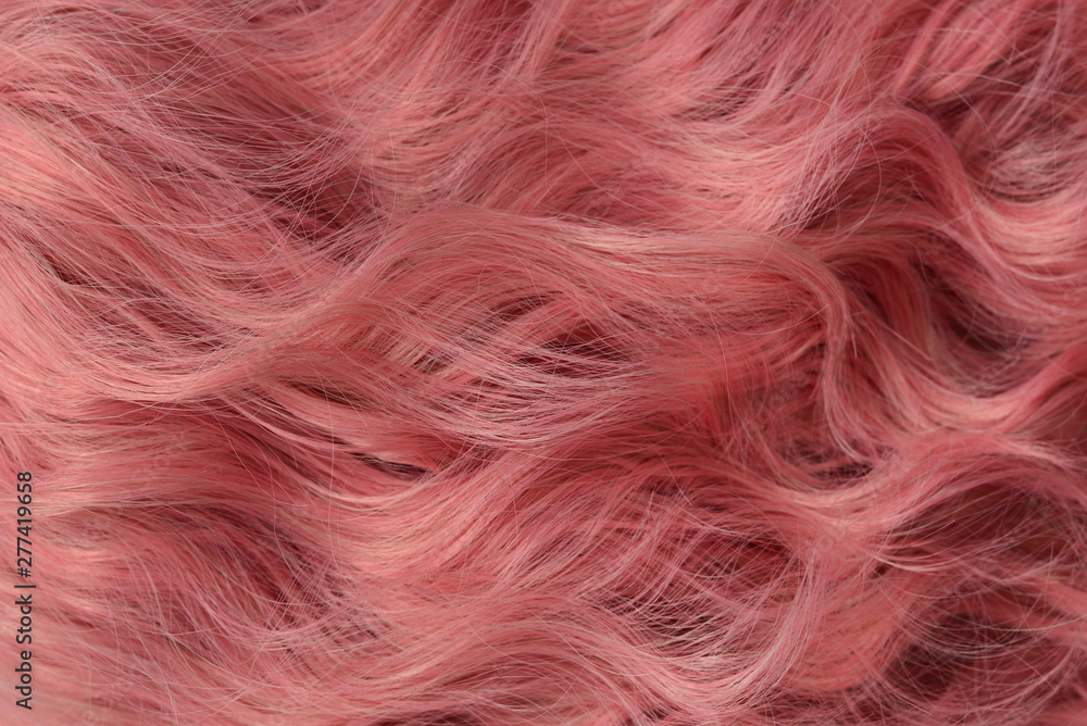 Wall mural pink wavy hair pattern. top view.