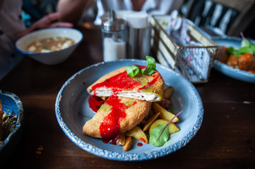 Chicken schnitzel with ketchup and potatoes