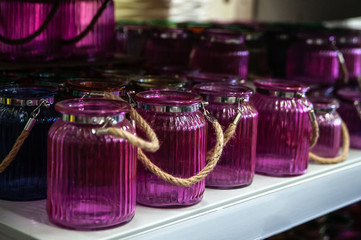 Purple vintage empty glass jars on the counter in the store