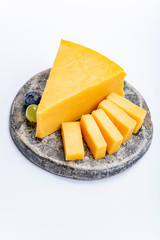 Cheddar cheese collection, piece of yellow Cheddar cheese made from cow milk