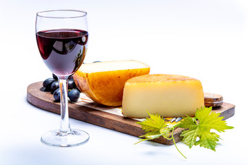 Hard Italian pecorino sheep cheese and glass with Italian red wine