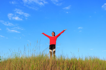 Girl in the nature doing yoga exercise for fitness.