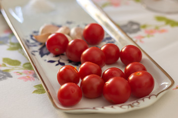 Cherry tomato with garlic on a table