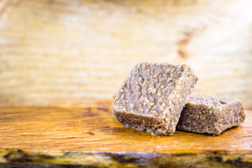 Sweet pele foot, sweet peanut typical of Brazil, state minas gerais. Brazilian sweet ground peanut, on table of emadeira, space for text.