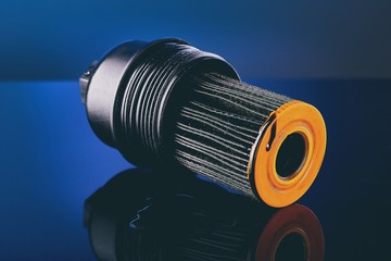 car engine oil filter on dark background