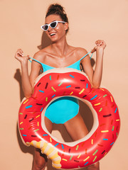 Young beautiful sexy smiling hipster woman in sunglasses.Girl in summer swimwear bathing suit with...