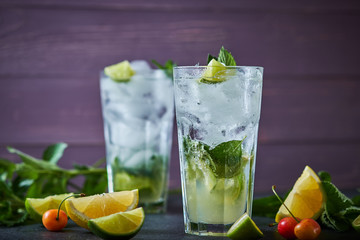 Mojito refreshing summer cocktail. Ingredients: ice, soda, rum, sugar syrup, lime, mint.