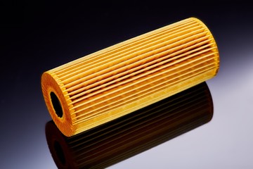 car engine oil filter on dark background