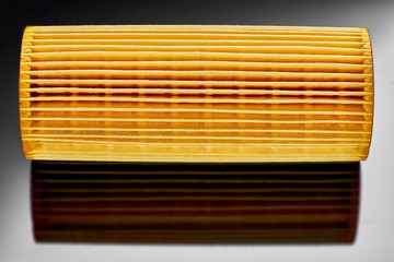 car engine oil filter on dark background