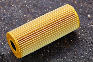 car engine oil filter on dark background