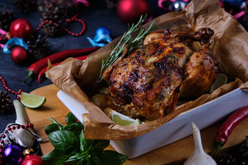Chicken baked in the oven with spices, lemon and herbs. A dish made for Christmas.