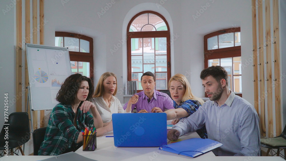 Poster meeting in the office. young creative professional team sharing new ideas and discussing strategy. p