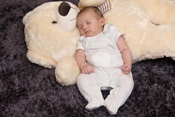 Baby Boy Sleeping with Big Teddy Bear