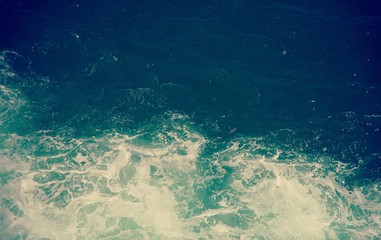 Close up on a boat wake in black and white, in deep ocean water