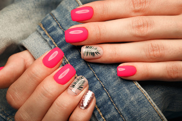 Bright neon manicure on female hands on the background of jeans. Nail design. Beauty hands. - obrazy, fototapety, plakaty