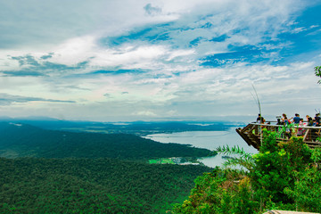 Aerial view of Langkawi island's mountains, forest and tourist enjoying view from observation deck