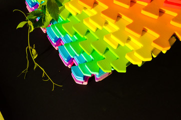 Rainbow stripes, steps with leaves, futurism abstraction on a black background