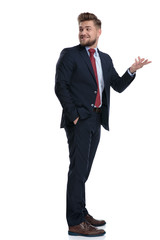 Happy businessman looking over his shoulder and smiling