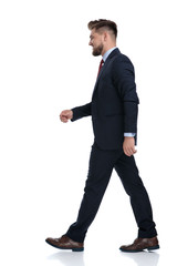 Side view of a determiend busineesman walking