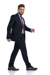 Side view of a confident businessman walking