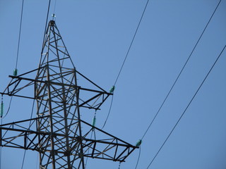 high voltage tower . overhead power line on a blue background.