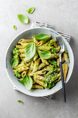 Tasty appetizing pasta with pesto sauce