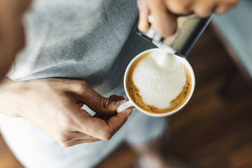 Barista making classic cappuccino