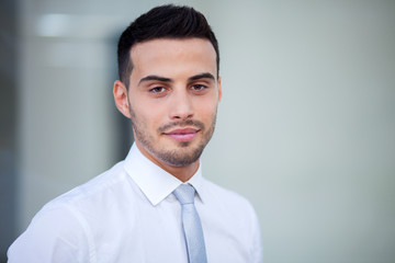 Young businessman outdoor in a modern city setting