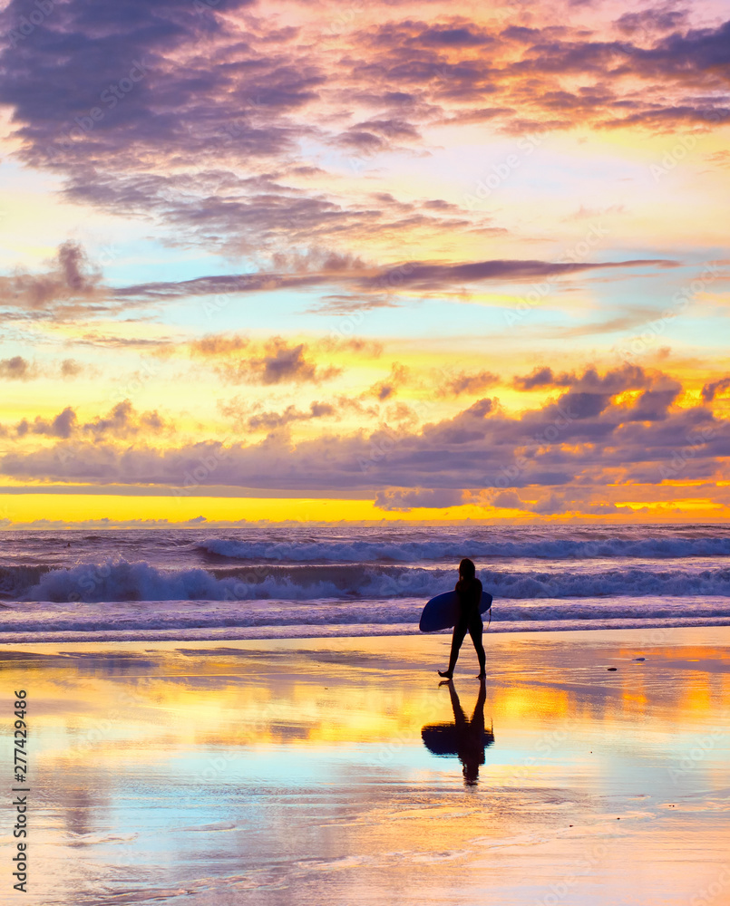 Wall mural surfer surfboard sunset bali beach