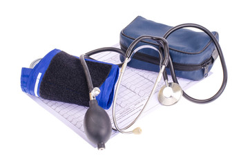 Analog blood pressure meter (tonometer) and notepad on the background of medical graphs,...
