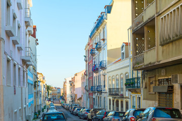 Fototapeta na wymiar Cars Old Town street Lisbon