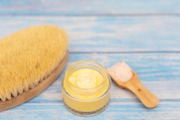 skin care products - cream, body brush and salt for scrub