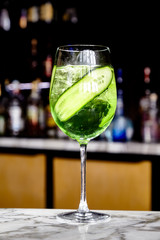 Hugo Elderflower Cocktail .Cocktail with green liqueur and cucumber .