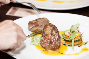 serving of grilled meat served on the table