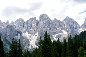 Obraz premium Pale di San Martino range panorama landscape during summer season. Passo Rolle summer landscape - Pale di San Martino range. Trentino Alto Adige. Mountain landscape in summer, Italian Dolomites.
