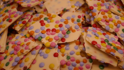 Homemade white chocolate bars with many colorful smarties