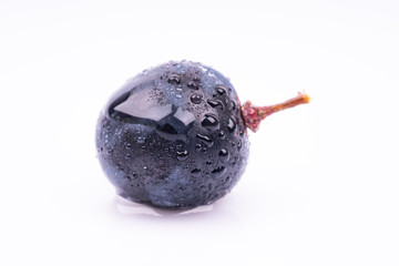 purple grapes with water drops on white background