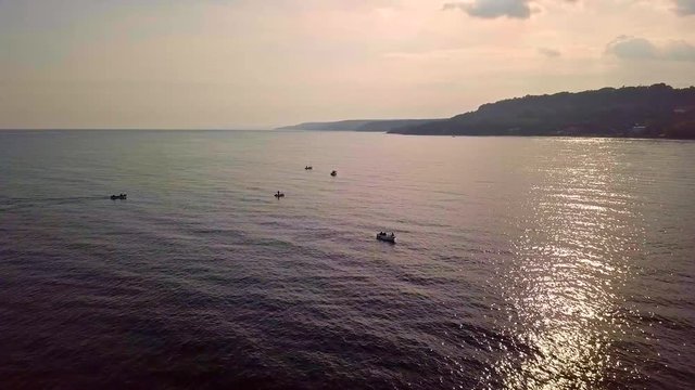 Flying over sea and boats