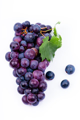 purple grapes with water drops on white background