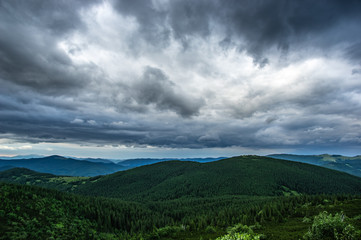 Rain clouds in the evening over the mountains