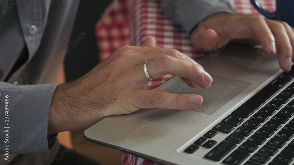 Aufkleber close up details man typing on laptop. male hands entering data on keyboard