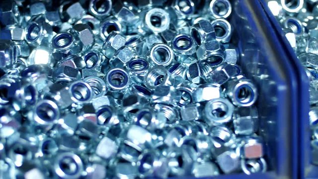 Shiny nuts for industrial needs. Manufacture of metal products