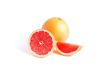 Whole, half and slice of grapefruit isolated on white